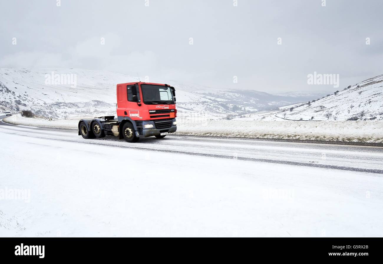 Traffic crosses the Brecon Beacons, South Wales, where snow is settling and even more has been forecast by the MET office for Friday 18th January over South Wales and the Westcountry. Stock Photo