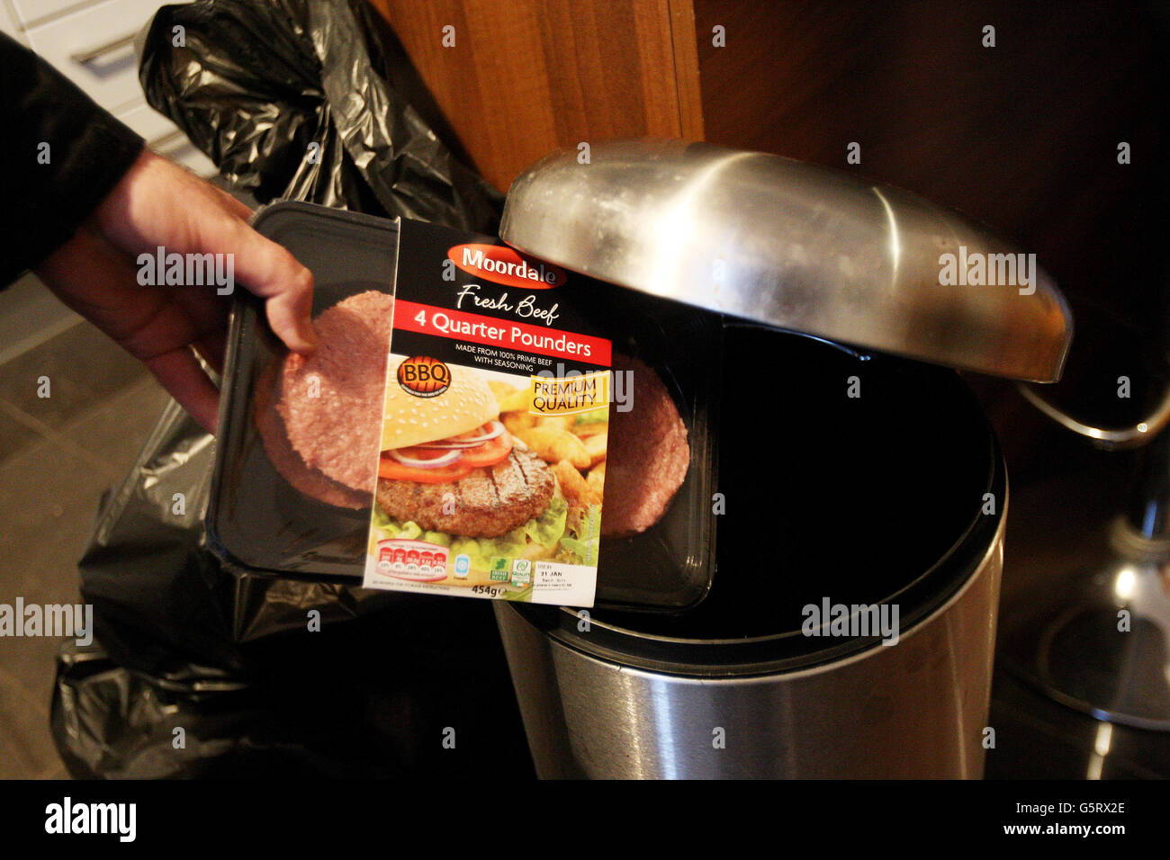 Horse meat found in beef products. A packet of Burgers is thrown into a bin. Stock Photo