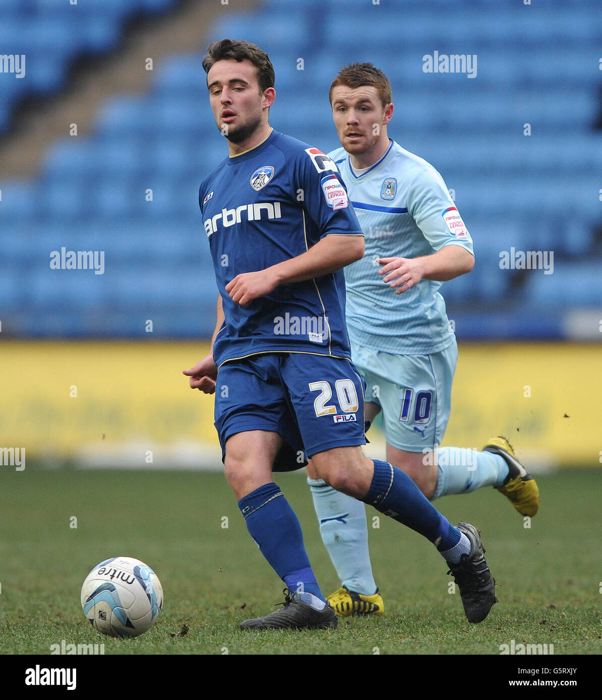 Coventry City's John Fleck (right) and Oldham Athletic's Jose Baxter (left) during the npower League One match at the Ricoh Arena, Coventry. Stock Photo