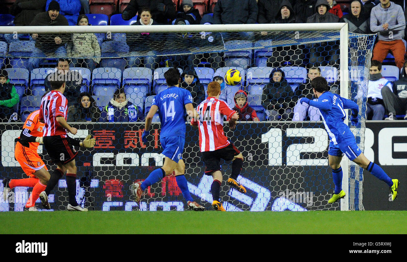 Wigan Athletic's Angelo Henriquez scores his teams second goal during the Barclays Premier League match at the DW Stadium, Wigan. Stock Photo