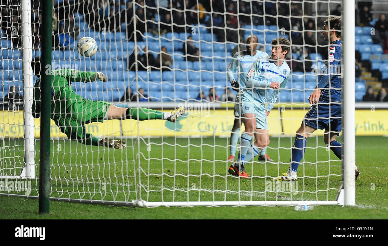 Coventry City's Stephen Elliott's header is saved by Oldham Athletic's Dean Bouzanis during the npower League One match at the Ricoh Arena, Coventry. Stock Photo