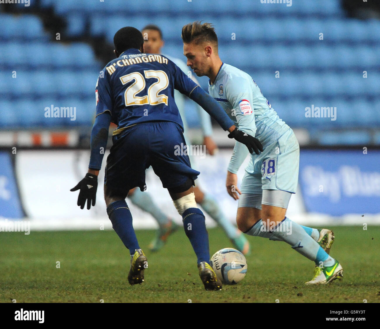 Coventry City's James Bailey (right) and Oldham Athletic's Youssouf M'Changama (left) during the npower League One match at the Ricoh Arena, Coventry. Stock Photo