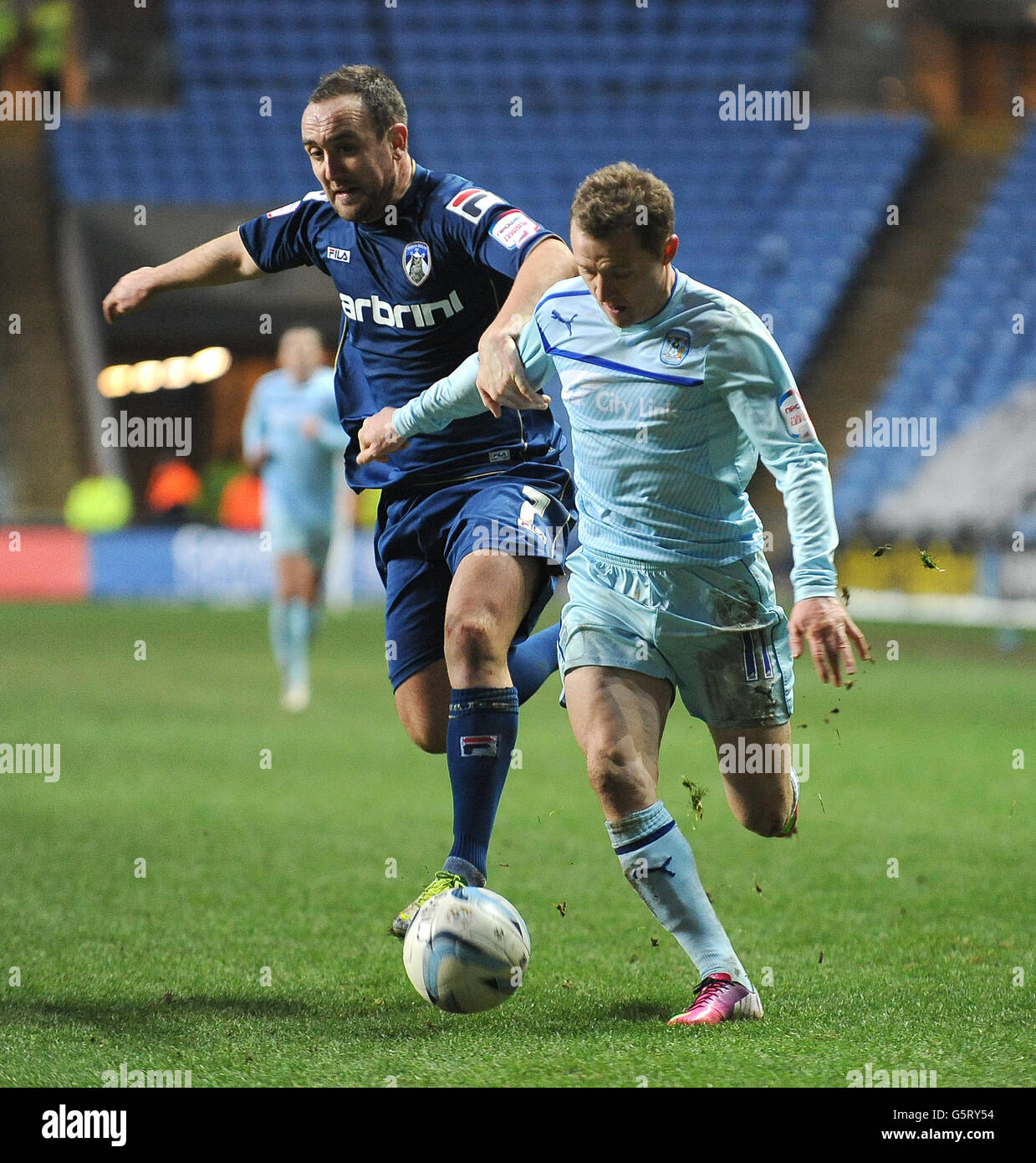 Coventry City's Gary McSheffrey (right) and Oldham Athletic's Connor Brown (left) during the npower League One match at the Ricoh Arena, Coventry. Stock Photo