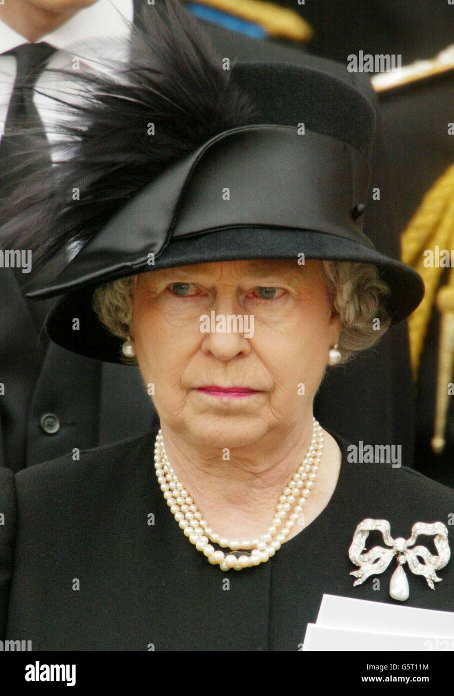 The Queen leaves Westminster Abbey following the funeral of the Queen Mother in central London. Royal dignitaries and politicians from around the world have gathered at Westminster Abbey to pay their respects to the Queen Mother who died aged 101. * She will be interred at St. George's Chapel in Windsor next to her husband King George VI. Stock Photo