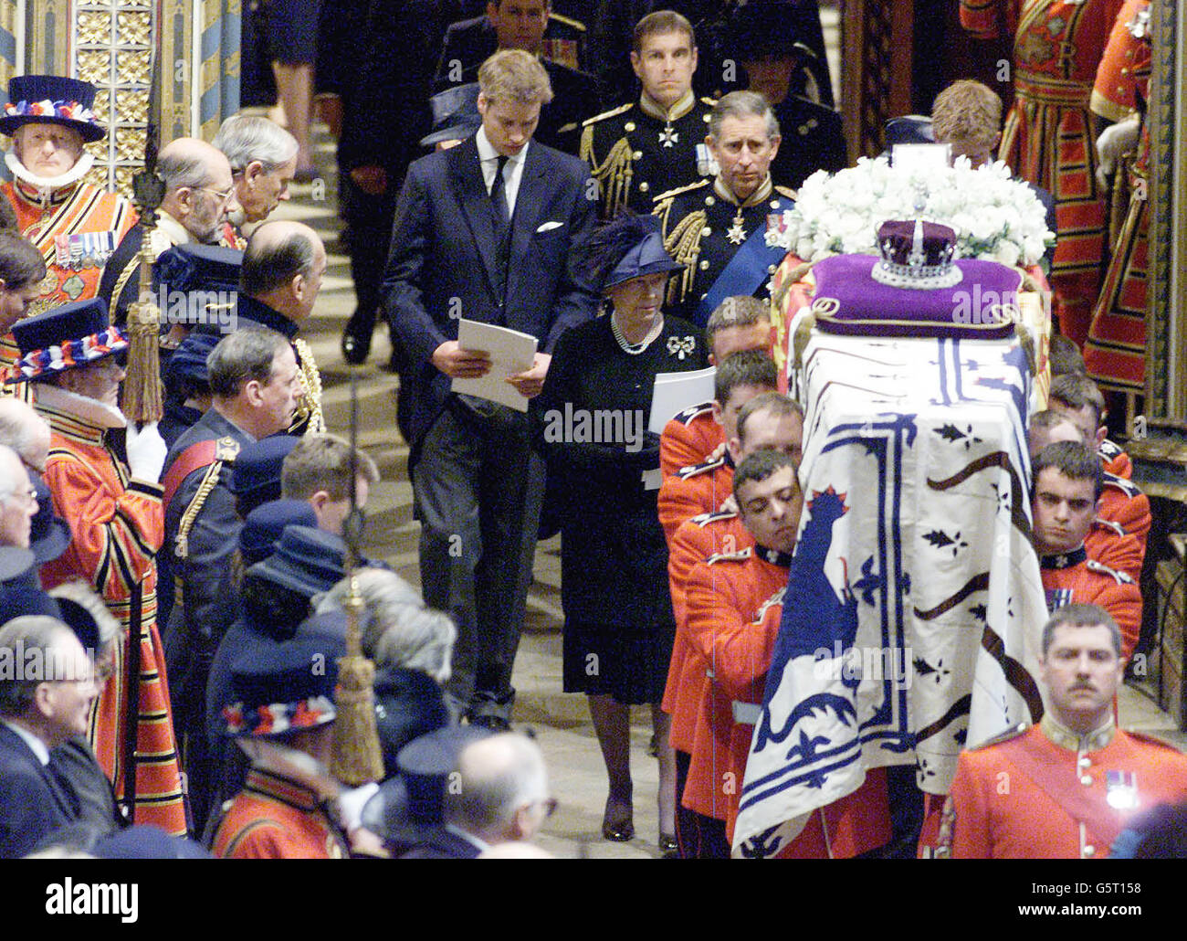 Members of the Royal Family including Queen Elizabeth II, Prince Charles, Prince William, Prince Harry, the Duke of York and the Earl and Countess of Wessex follow on behind the coffin of Queen Elizabeth, the Queen Mother at Westminster Abbey. *The Queen Mother died Saturday March 30, 2002, aged 101. After the service, the Queen's Mother's coffin was due to be taken to St George's Chapel in Windsor, where she will be laid to rest next to her husband, King George VI. Stock Photo