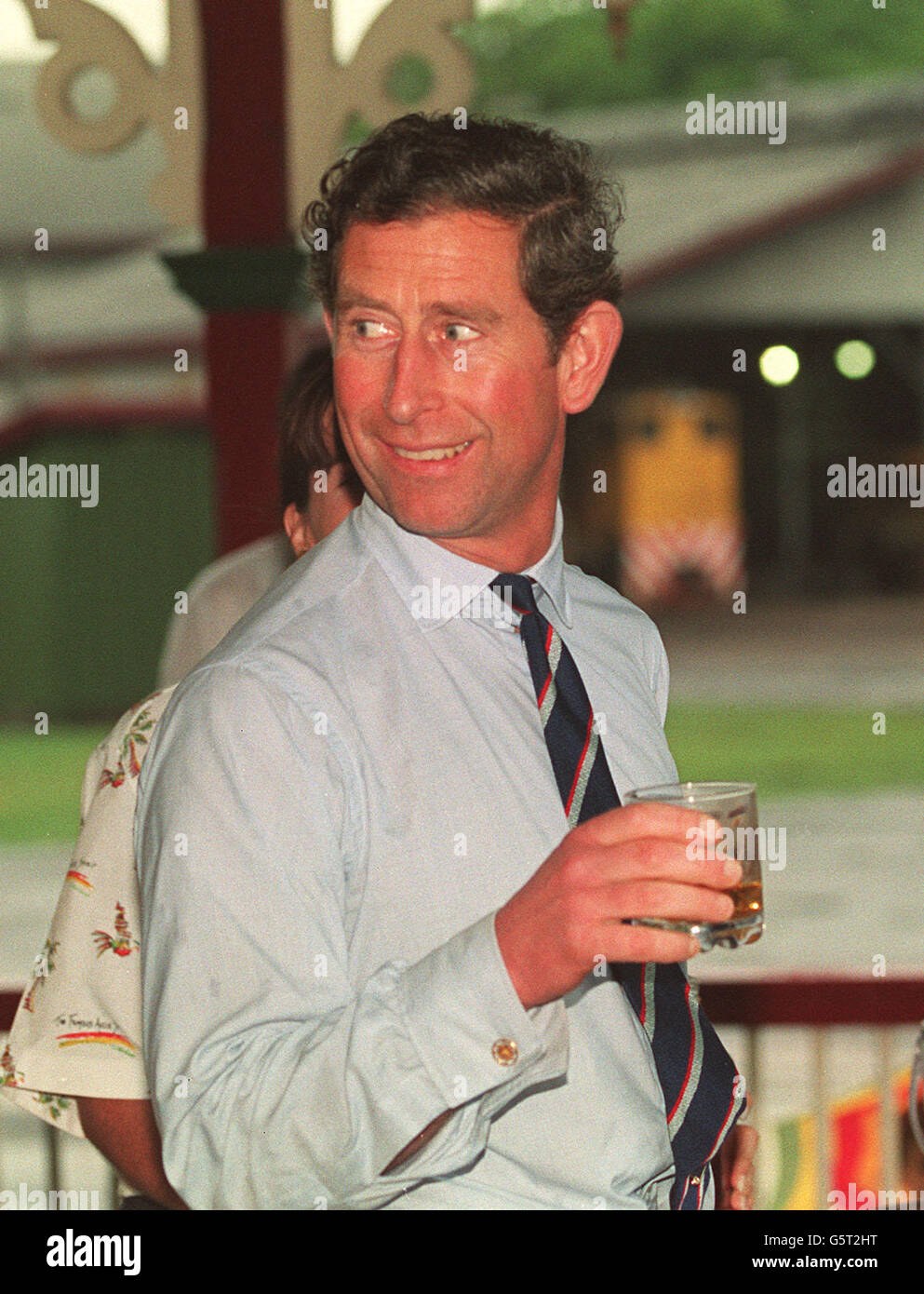 The Prince of Wales in Bundaberg, samples a glass of rum at the Bundaberg distillery. Stock Photo