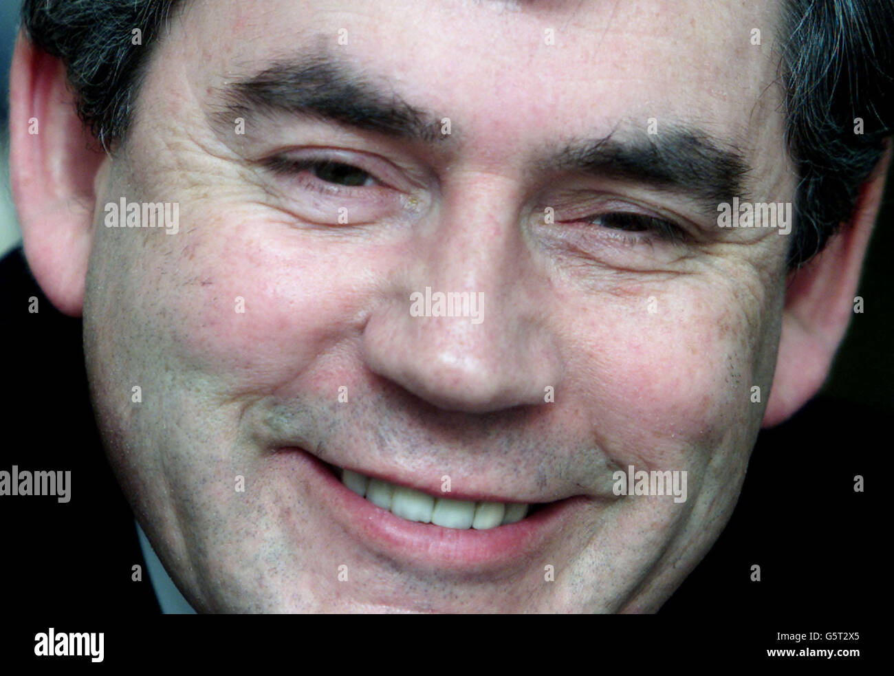 Chancellor of the Exchequer Gordon Brown smiles in his Downing Street apartment as he prepares to deliver his 2002 budget. Brown is expected to announce an increase in National Insurance contributions to help pay for the rejuvenation of the National Health Service. Stock Photo