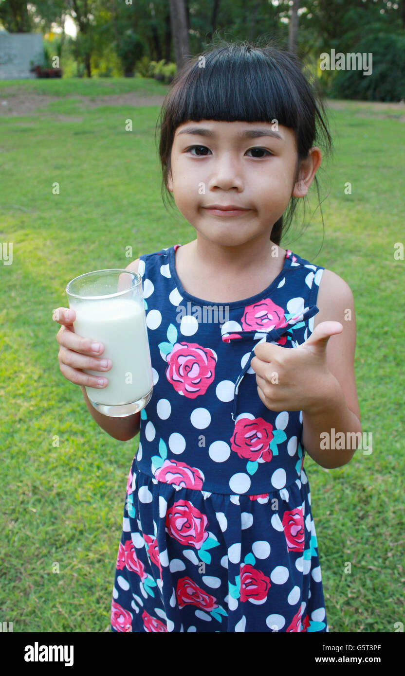 Young girl drinking milk Stock Photo Alamy