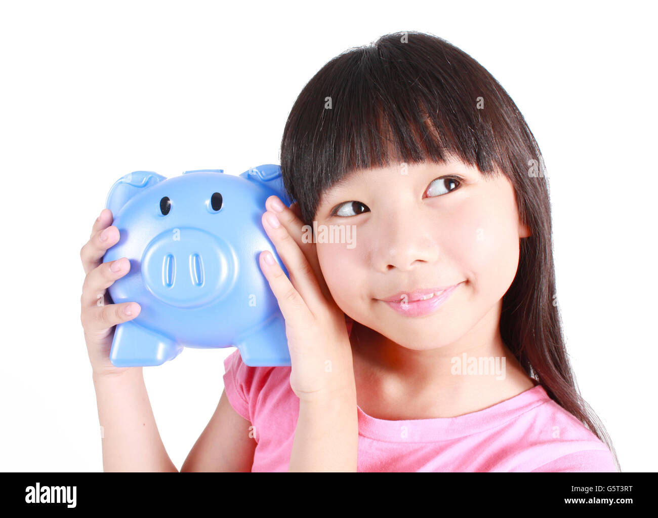 Young girl holding piggy bank Stock Photo - Alamy