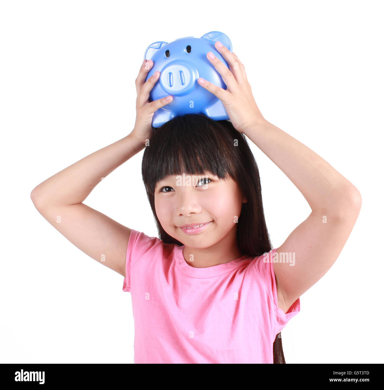 Young girl holding piggy bank Stock Photo - Alamy