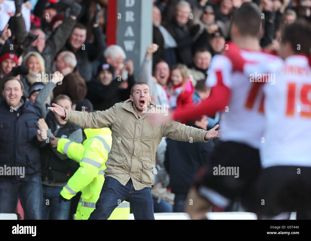 A fan can't hide his delight as Brentford's Marcello Trotta celebrates scoring their first goal of the game Stock Photo
