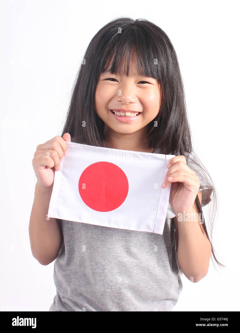 Cute girl holding Japanese Flag Stock Photo