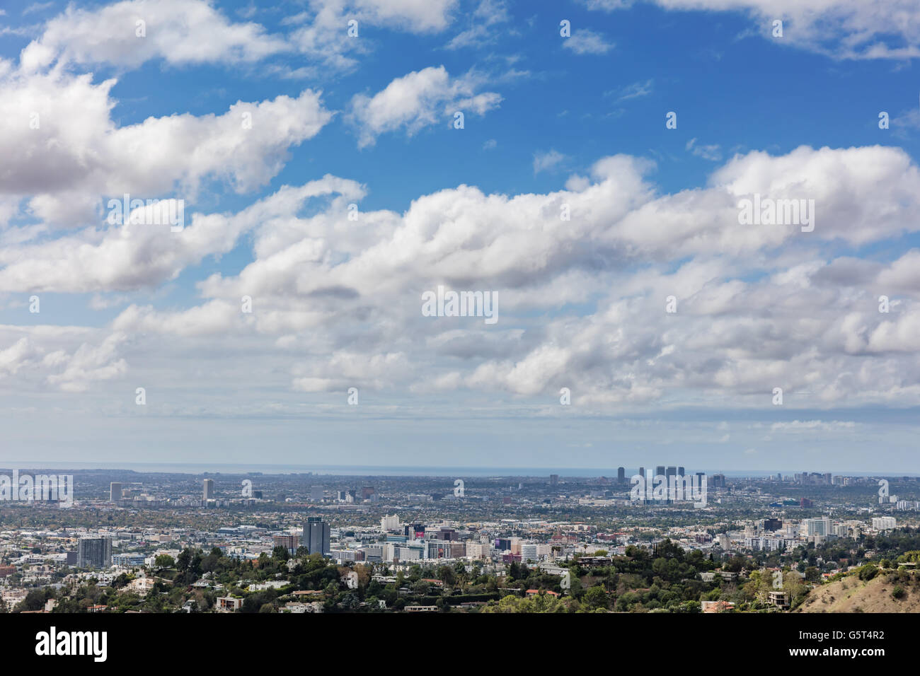 Los Angeles skyline with many white clouds in a blue sky Stock Photo ...