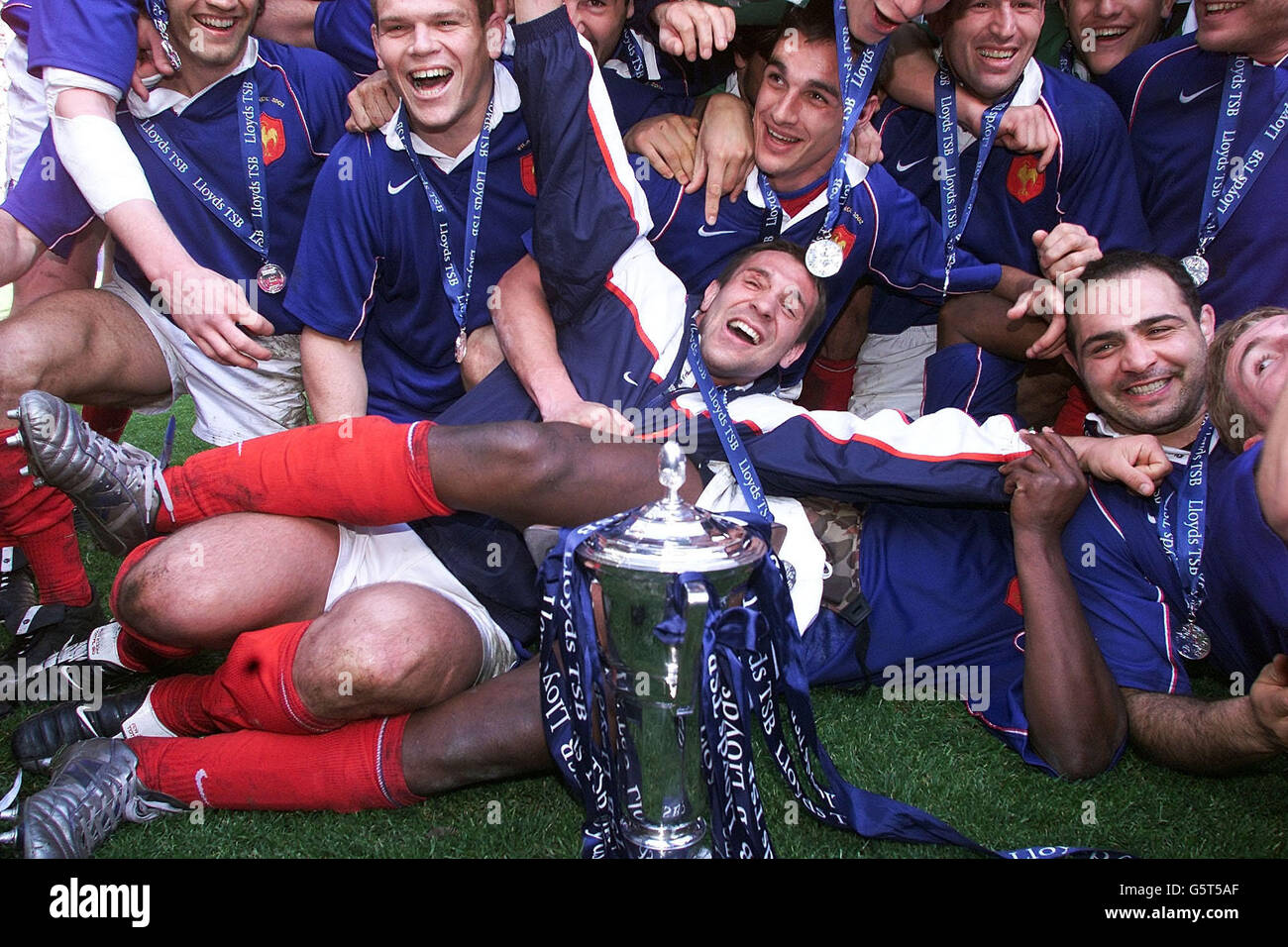 French players celebrate thier Grand Slam during the trophy presentation after defeating Ireland in the Lloyds TSB Six Nations Championship at France's Stade de France stadium. Stock Photo