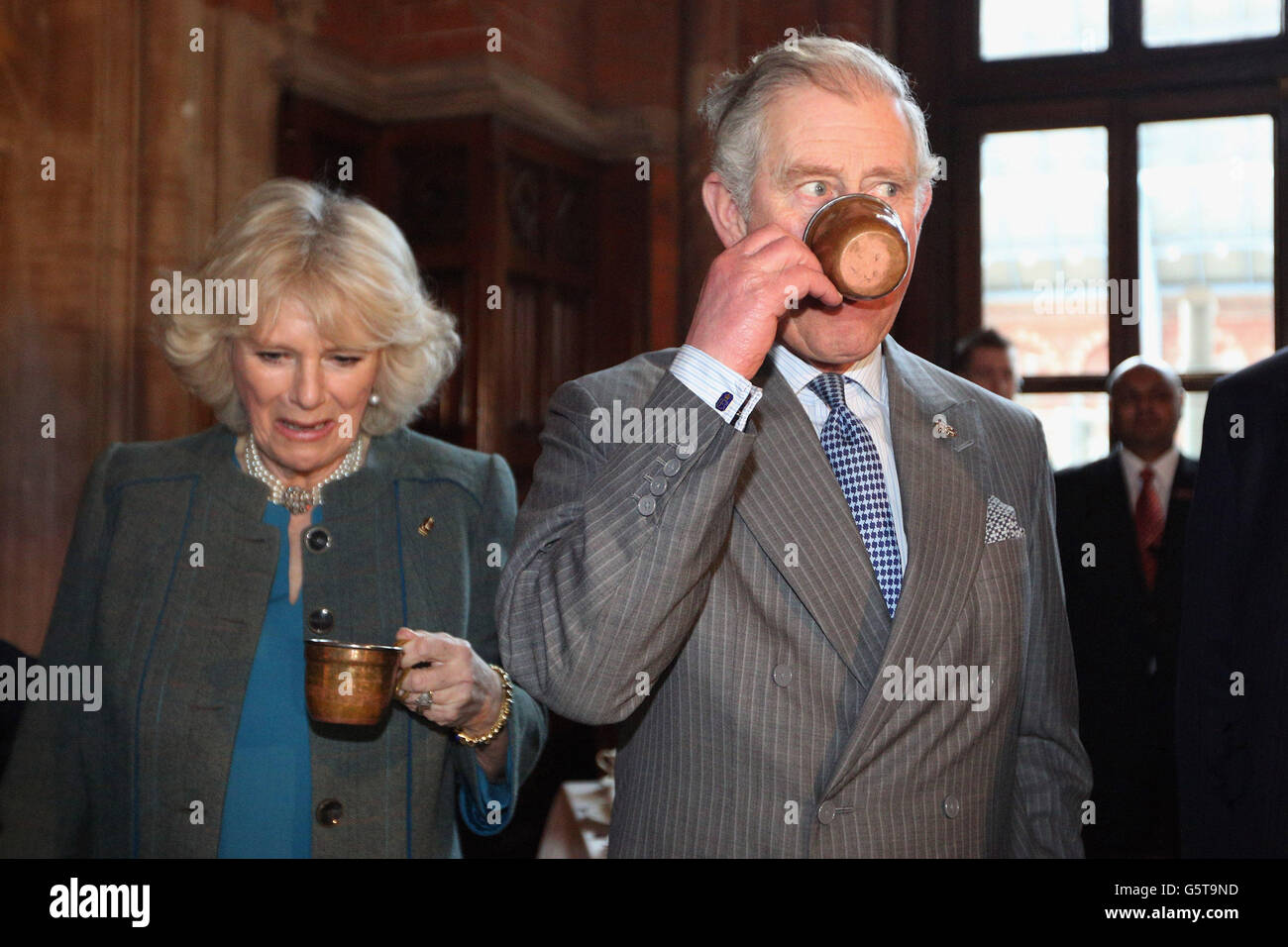 The Prince of Wales and The Duchess of Cornwall drink a punch made from a Victorian recipe during a visit to the recently regenerated St Pancras Renaissance London Hotel adjacent to St Pancras International Station as they mark 150 years of London Underground. Stock Photo