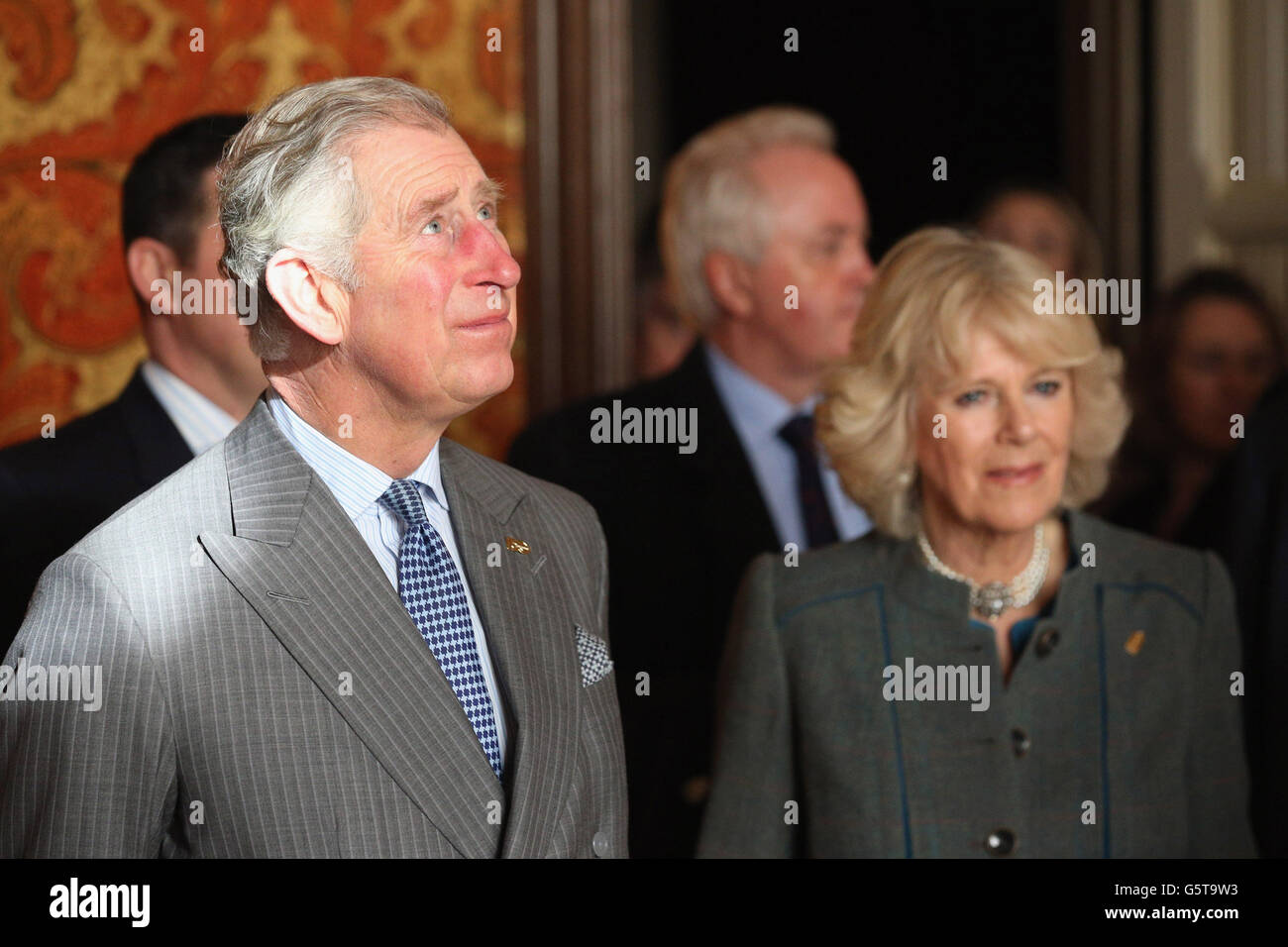 The Prince of Wales (left) and The Duchess of Cornwall admire a guest room during a visit to the recently regenerated St Pancras Renaissance London Hotel adjacent to St Pancras International as they mark 150 years of London Underground.. Stock Photo