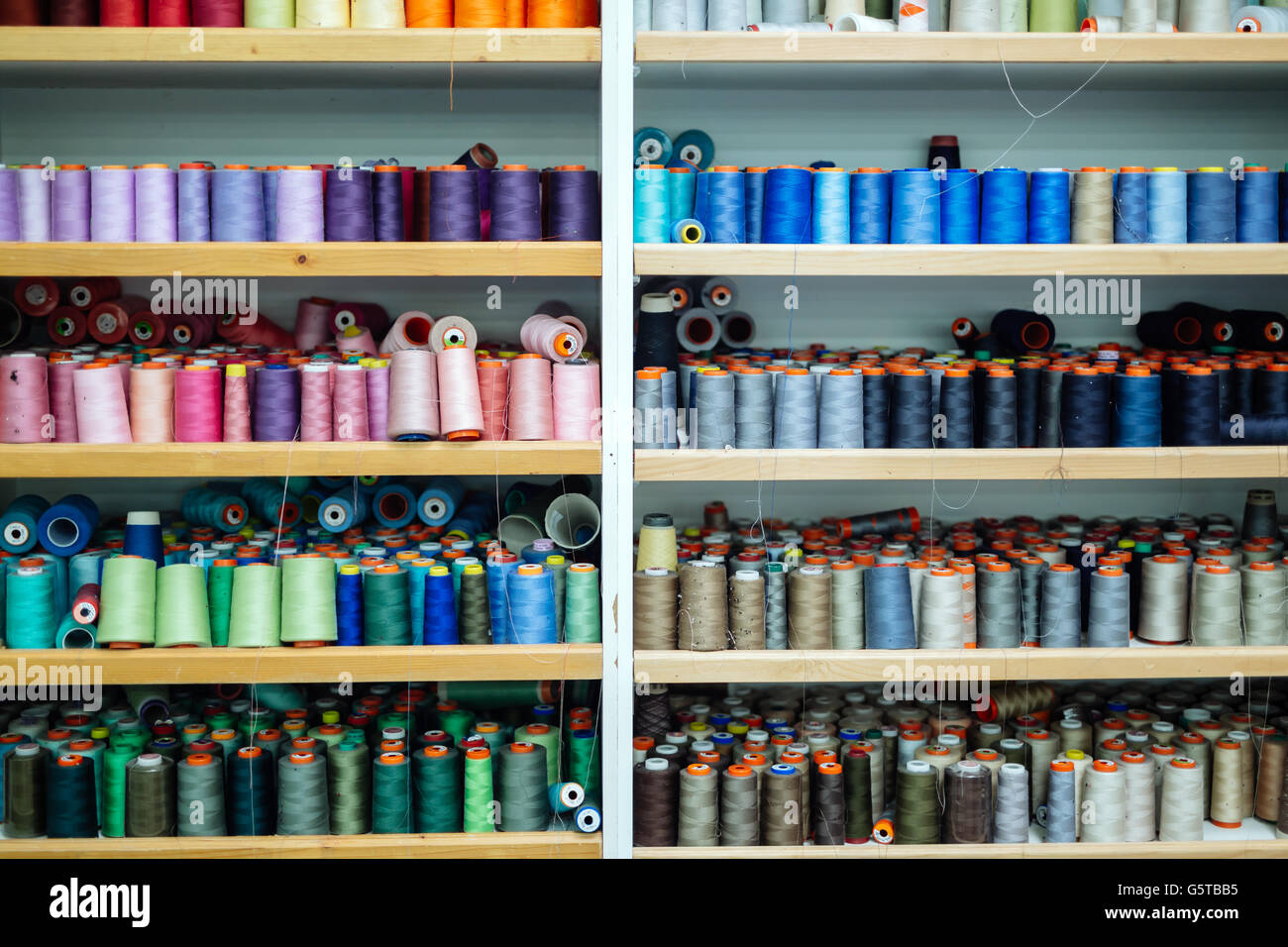 Colorful thread spools in fabric industry Stock Photo