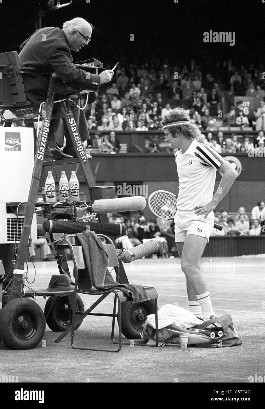 A frequently temperamental John McEnroe argues a point with umpire Pat Smythe on Wimbledon Centre Court during his match against Jimmy Connors. Stock Photo