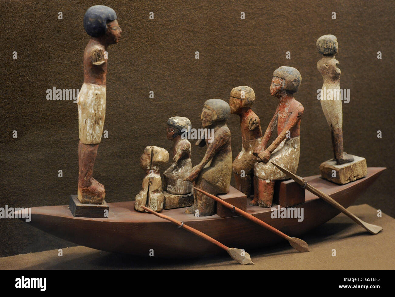 Egyptian boat crew. Rowers and helmsman. Wooden statuettes located within rich tombs. The State Hermitage Museum. St. Petersburg. Russia. Stock Photo