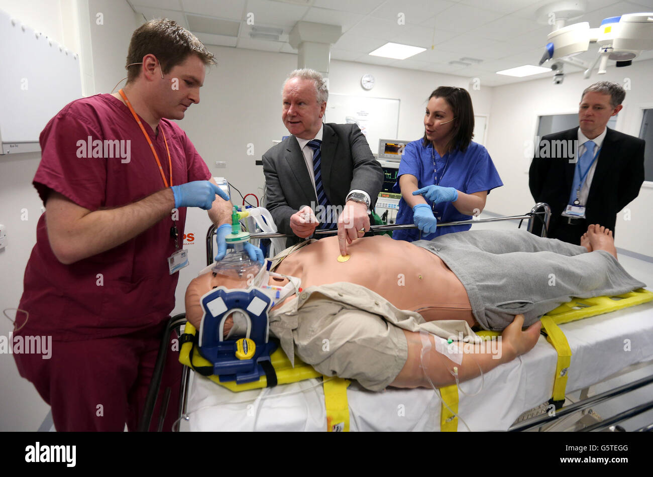 Health Secretary Alex Neil with robot patient "Stan" watched by registrar  Dr Stephen Hickey (far left) and Anesthetist Dr Donna Fraser (blue gown)  and Dr Michael Moneypenny (far right) during a visit