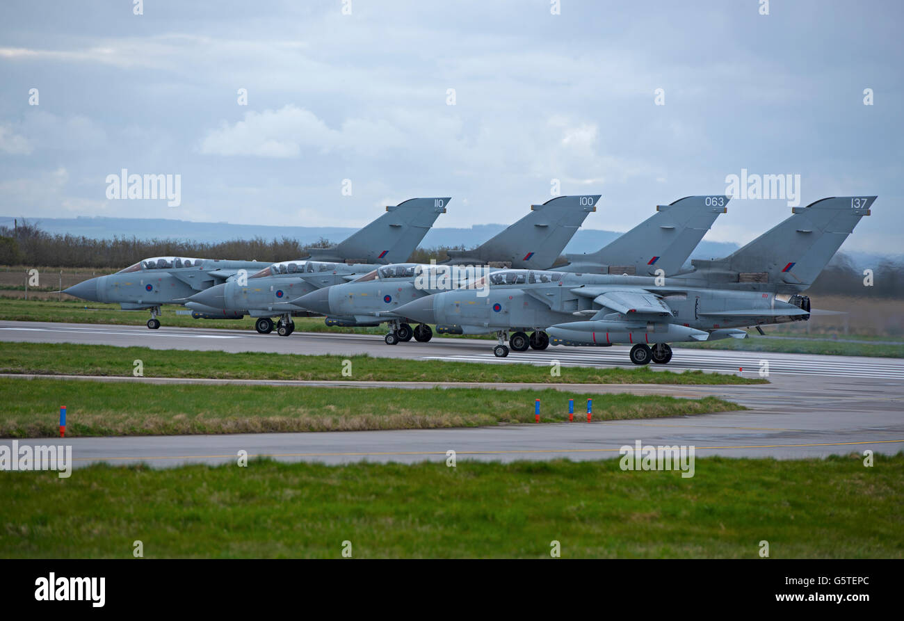 A Flight of four GR4 RAF Tornadoes prepare for take off at Lossiemouth Air Base on the Moray Coast Scotland.  SCO 10,530. Stock Photo