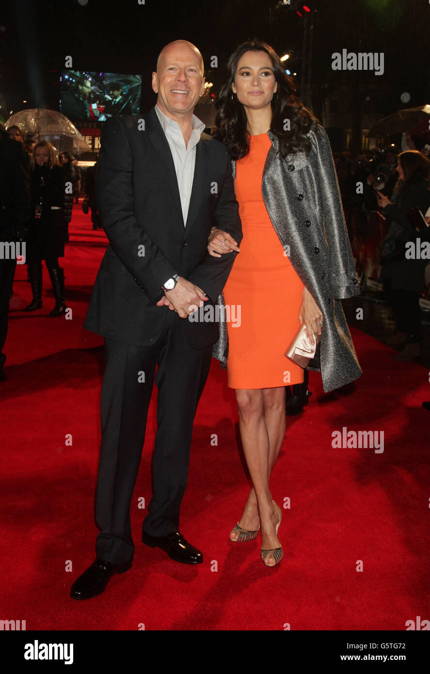 Bruce Willis and his wife Emma Heming arriving for the UK film premiere of A Good Day To Die Hard, at the Empire Leicester Square in central London. Stock Photo