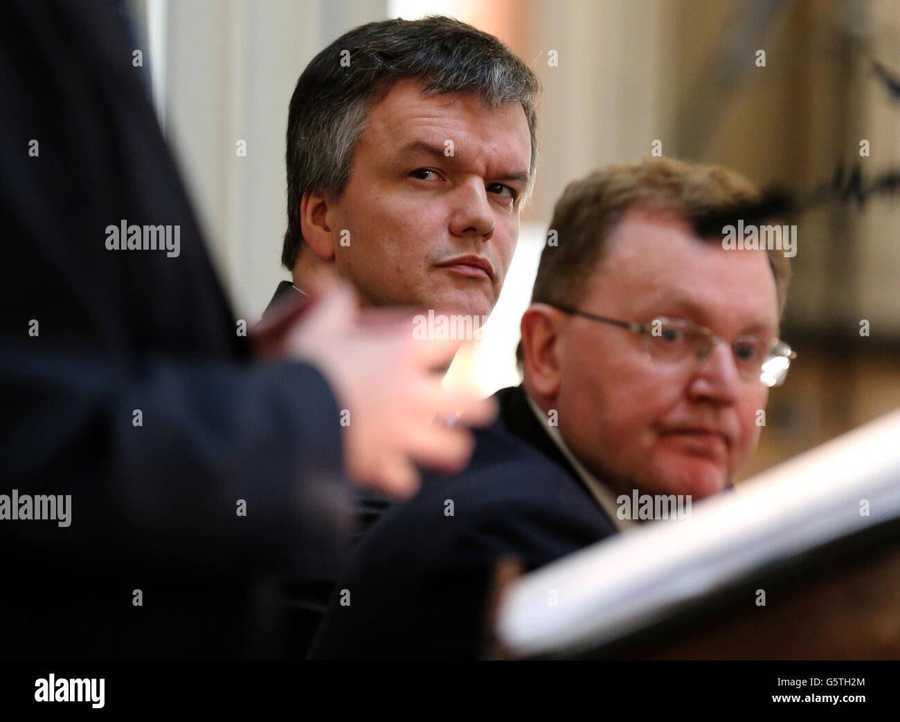 Scottish Secretary Michael Moore and Scotland Office Minister David Mundell watch Advocate General the Lord Wallace of Tankerness QC make a speech during the launch of UK Government's first Scotland Analysis Paper at the Signet Library in Edinburgh. Stock Photo