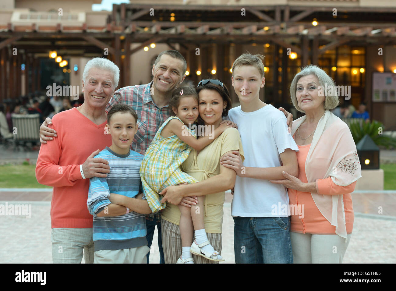 Portrait of a happy family relaxing at vacation resort Stock Photo - Alamy