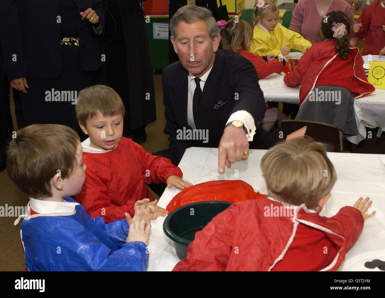 The Prince of Wales talks to pupils during a visit to the Lent Rise Combined School, Burnham, near Slough. The school is a leading light in a nationwide scheme inspired by Charles five years ago where trainee teachers get full-time hands-on experience. *... under supervision of experienced teachers as part of their training. Stock Photo