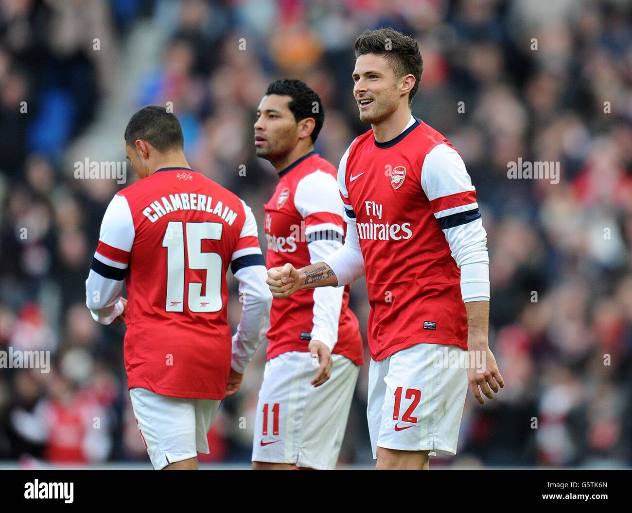 Arsenal's Olivier Giroud (no.12) celebrates scoring the opening
