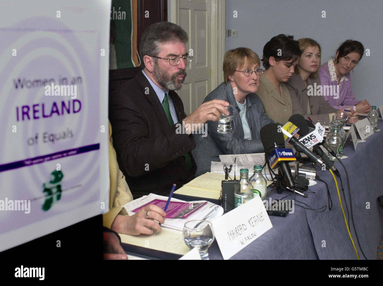 Gerry Adams, President of Sinn Fein in Dublin with (l-R) Anne Speed of the National Women's Forum, Mary Lou- Sinne Fein Candidate for Dublin West, Frances McCole, Sinn Fein Candidate for Dublin North Central and Lucilta Breathnach director of elections for Sinn Fein. * ... talking to the media about Sinn Fein's policies for women. Stock Photo