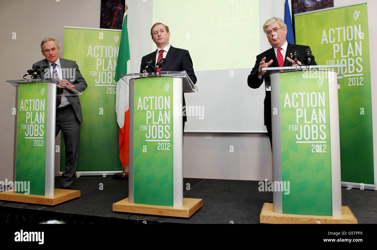 L-R Jobs Minister Richard Bruton, Taoiseach Enda Kenny and Tanaiste Eamon Gilmore announce the results of the fourth and final progress report under Action Plan for Jobs 2012 at Government Buildings today. Stock Photo