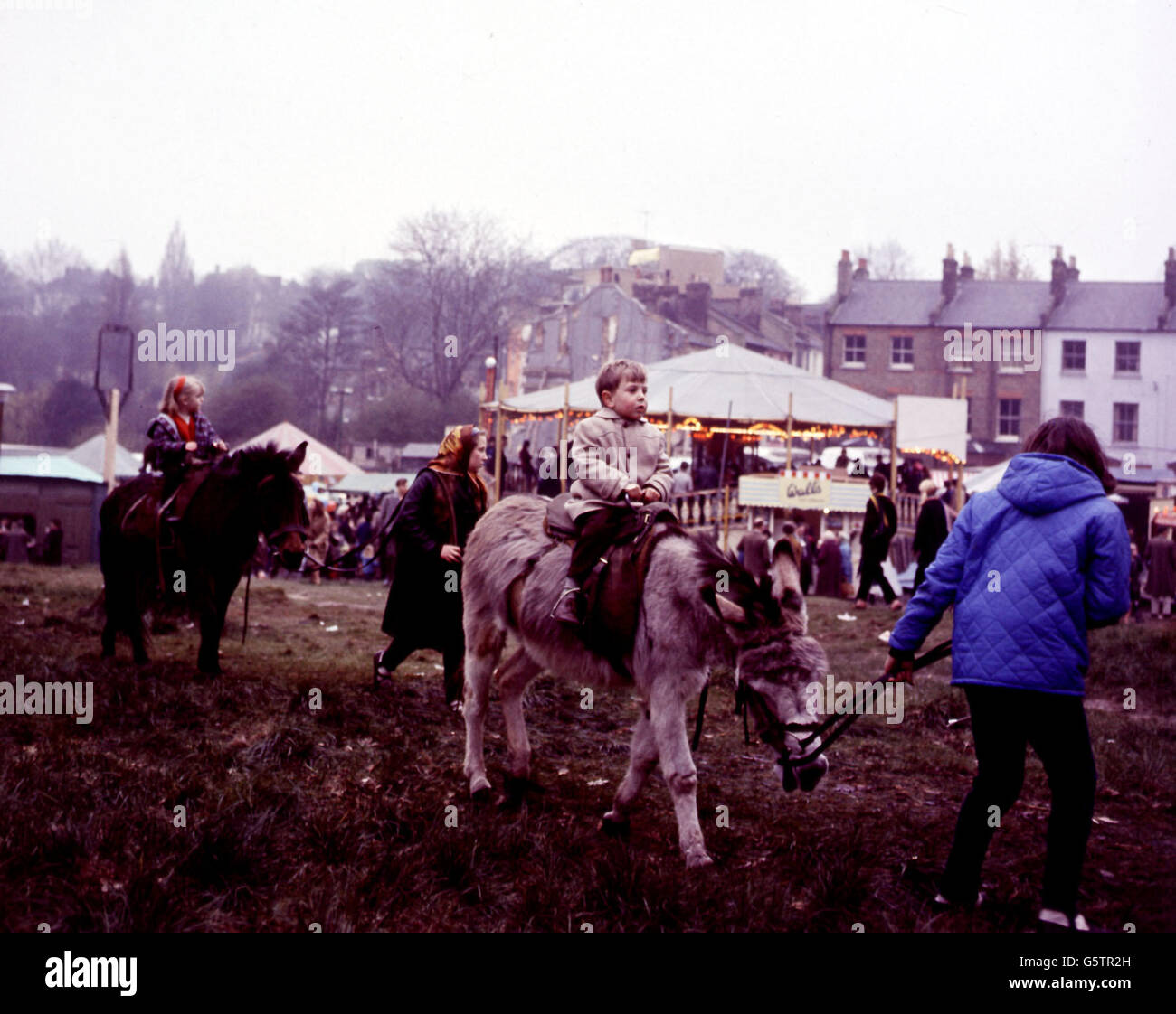 Donkey Rides And all The Fun Of The Fair On Hampstead Heath Stock donkey-rides-and-all-the-fun-of-the-fair-on-hampstead-heath-stock