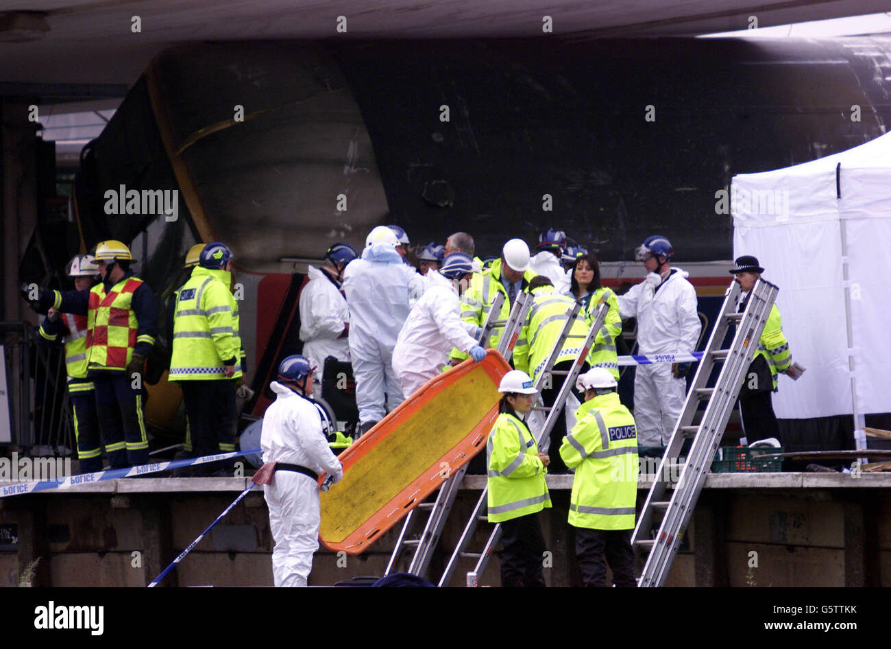 Scene of Crime Officer take a Stretcher up onto the platform at Potters Bar Train Station after
