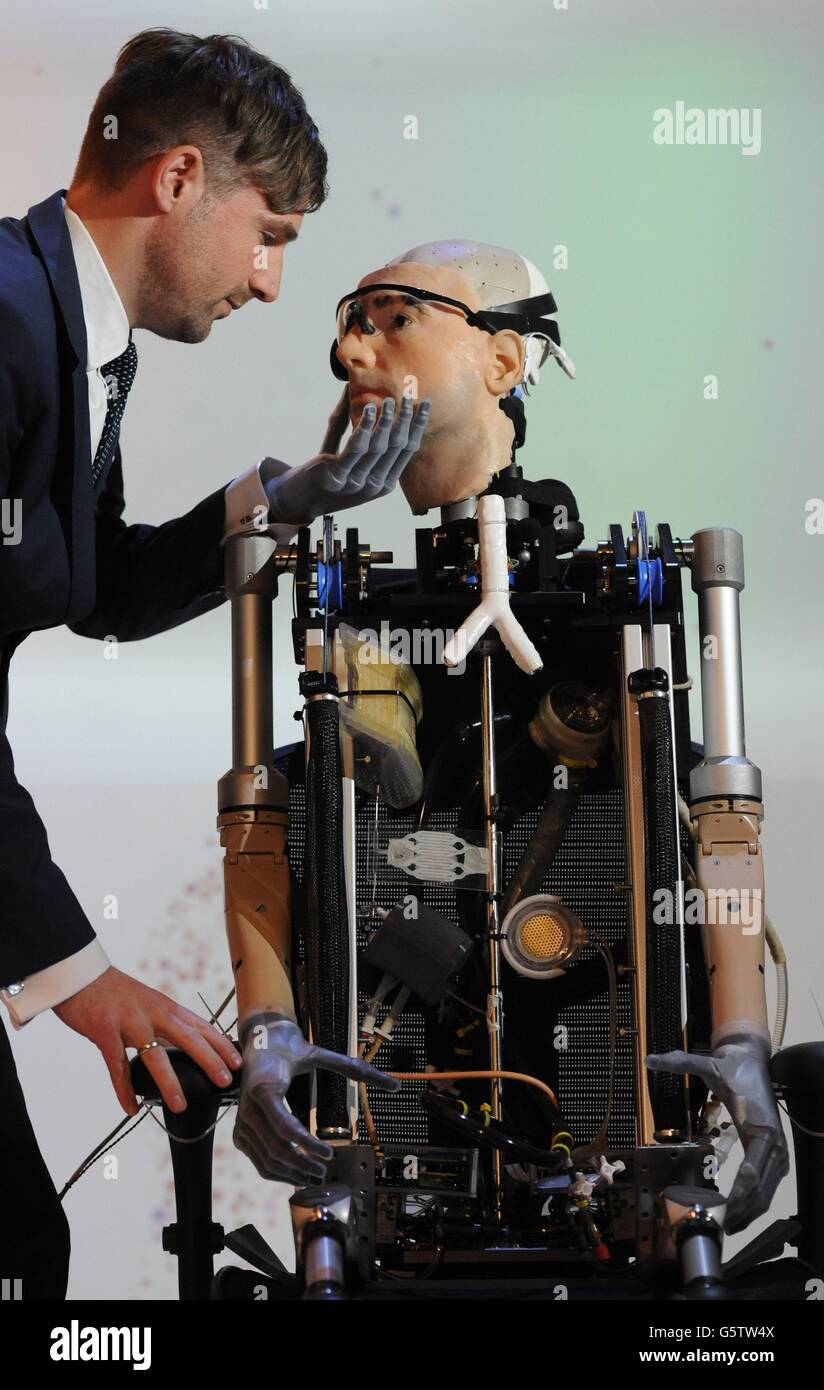 Bertolt Meyer looks at a 'bionic man' modeled on himself at the Science Museum in London. Stock Photo