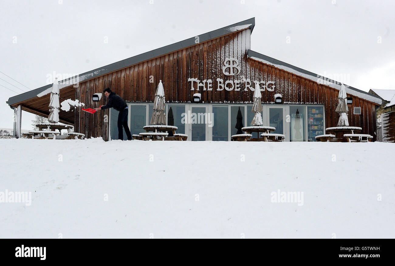 A man clears snow from paths at the Boe Rigg cafe in at Charlton near ...