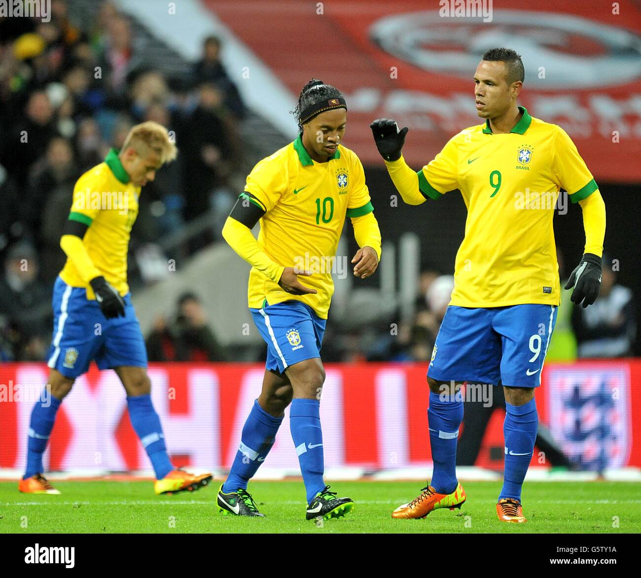 Brazil's Gaucho Ronaldinho (centre) reacts alongside team-mate Luis Fabiano (right) after having a penalty saved by England's goalkeeper Joe Hart (not in picture) Stock Photo