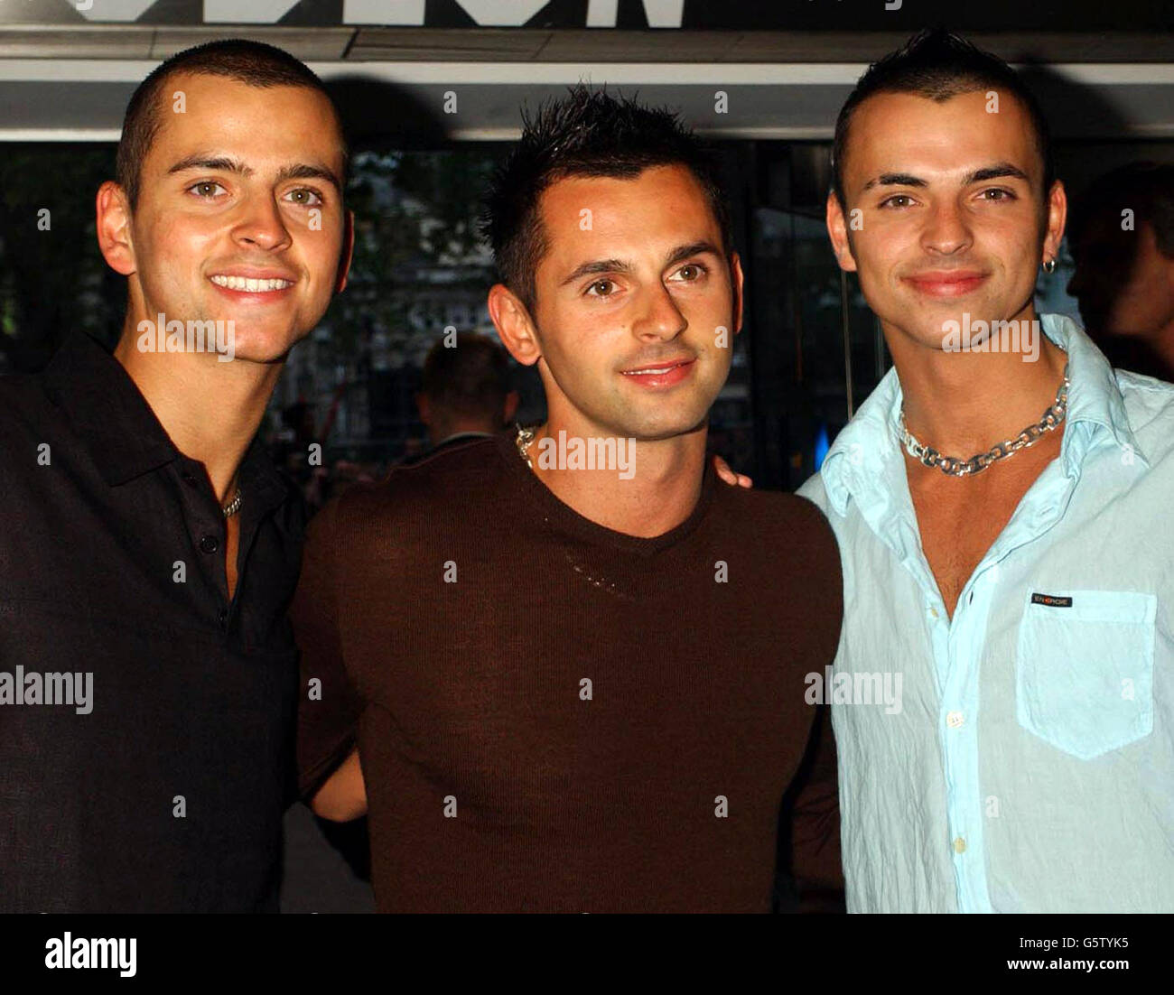 Pop band 3SL, from left, Anthony Scott-Lee, Steven Scott-Lee and Andy Scott-Lee arrive for the charity premiere of Star Wars: Episode II - Attack of the Clones at The Odeon Leicester Square in London. Stock Photo