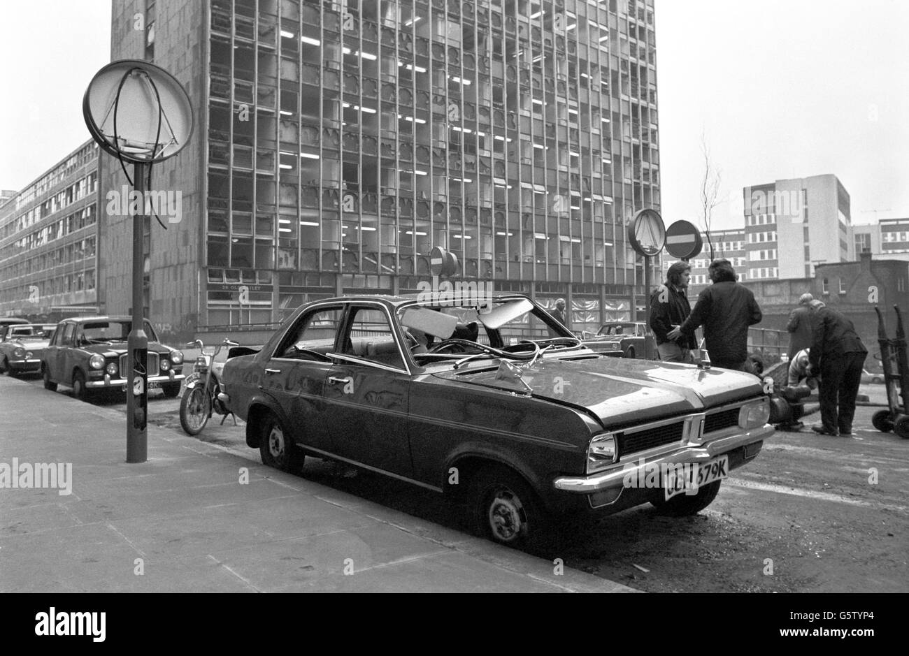 A damaged car stands outside the site of the Old Bailey bomb blast. Stock Photo