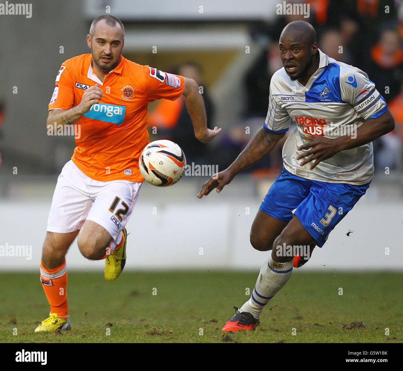 Soccer - npower Football League Championship - Blackpool v Millwall - Bloomfield Road. Blackpool's Gary Taylor-Fletcher and Millwall's Danny Shittu Stock Photo