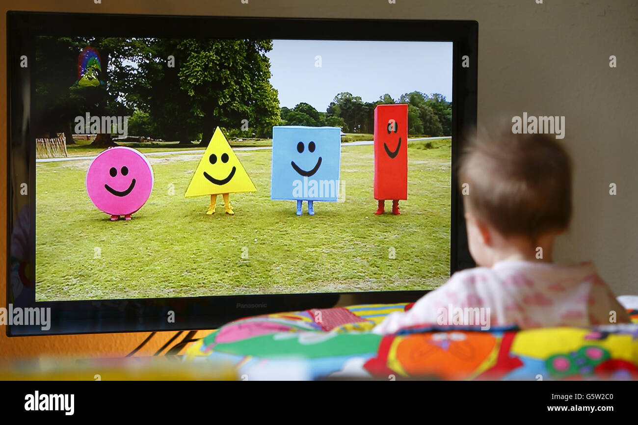 STOCK Baby. A baby watches the CBeebies television channel on a flat