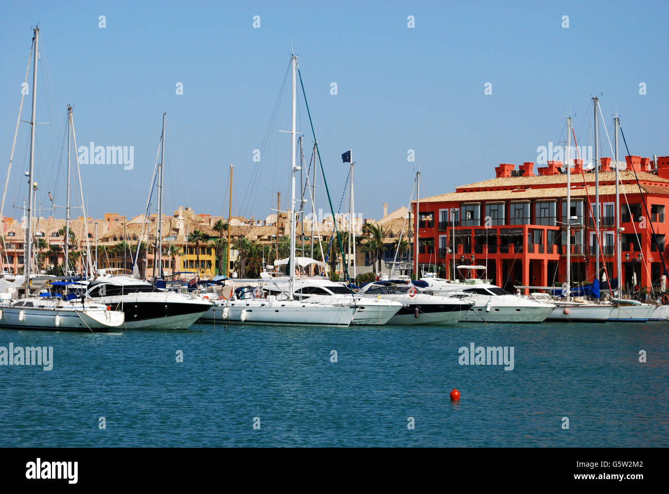 Yachts and boats in the marina with buildings to the rear, Puerto