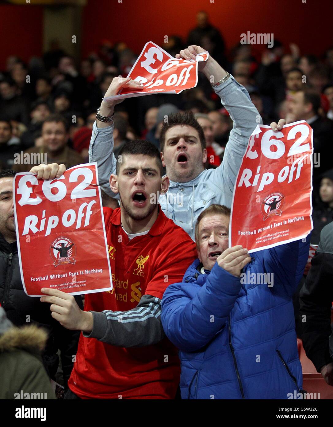 Soccer - Barclays Premier League - Arsenal v Liverpool - Emirates Stadium. Liverpool fans display signs protesting ticket prices in the stands before kick-off Stock Photo