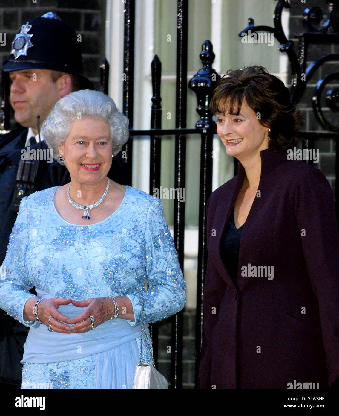Queen Elizabeth II stands alongside Cherie, the wife of British Prime Minister Tony Blair, outside 10 Downing Street, where Mr Blair was hosting a celebratory royal Golden Jubilee dinner. The Queen, the Duke of Edinburgh and four former Prime Ministers were attending along with the relatives of five other prime ministers who held power during the Queen's 50-year reign but have since died. Stock Photo