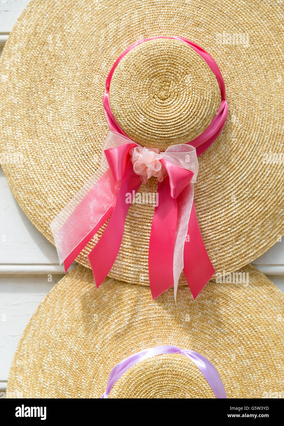 Traditional straw hats with ribbons Stock Photo