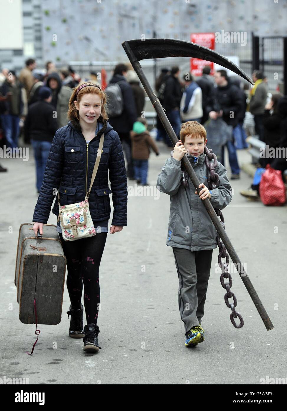 Jessica and Robert Hubery from Buckingham leave with items purchased at the  London Dungeon 'Carnage Car Boot Stall' held at the Capital Car Boot Sale  in Chichester Street, Pimlico, London Stock Photo -