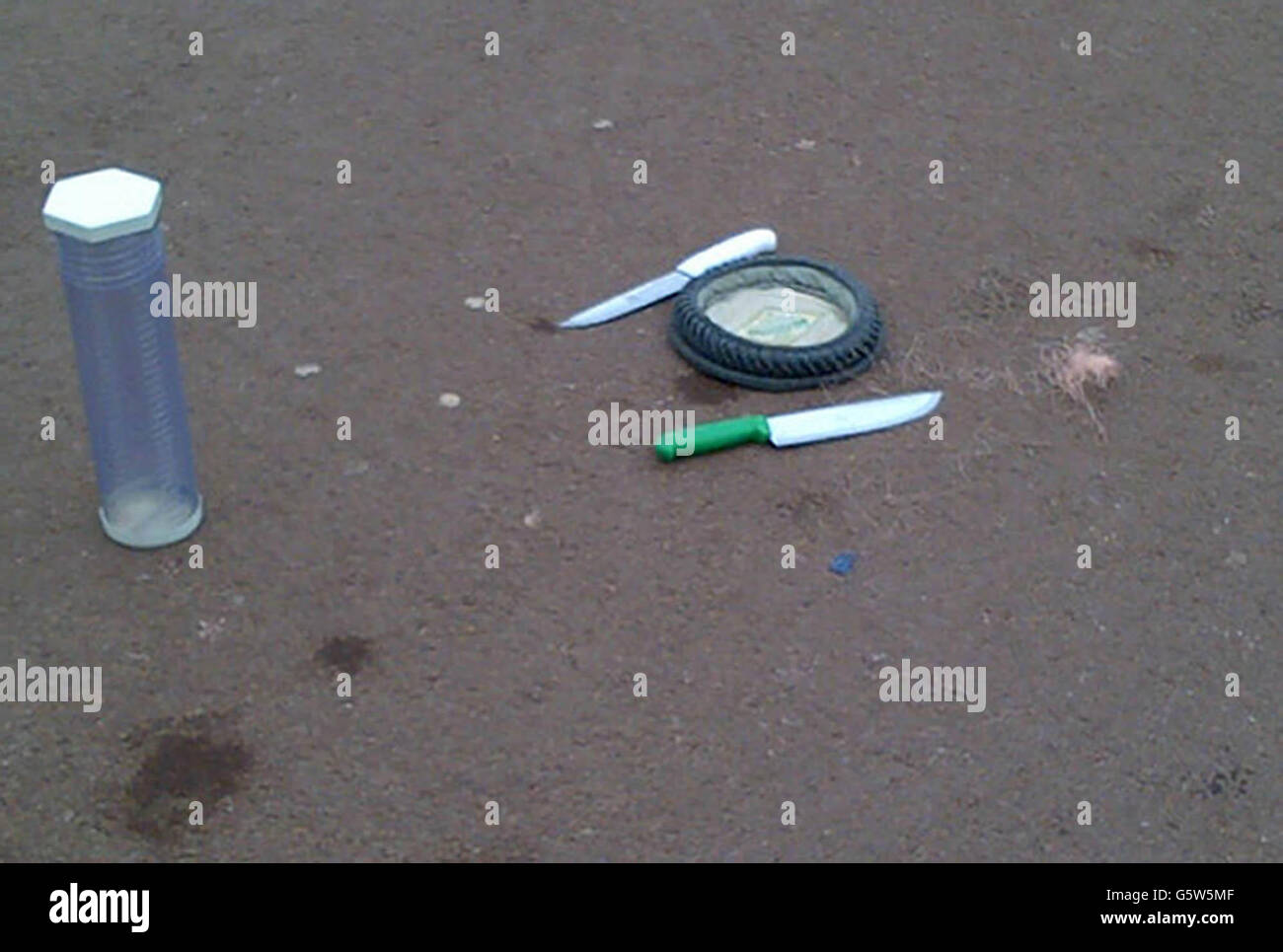 Knives, a hat and Taser wire in an A cornered off area outside Buckingham Palace in central London after a man was been Tasered by police. Stock Photo