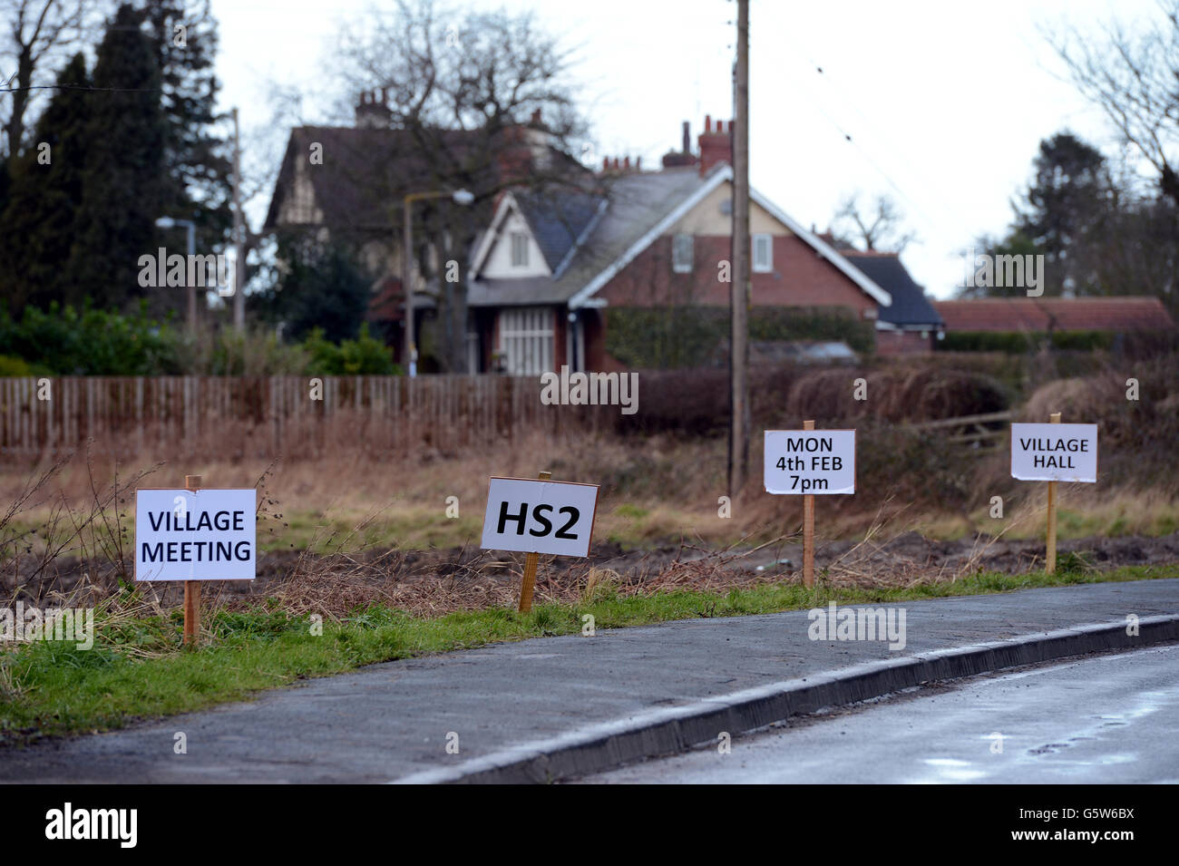 Signs along the main road in the village of Church Fenton in Yorkshire where villagers are holding a meeting tonight to discuss their opposition to the route of HS2 that was announced last week. Stock Photo