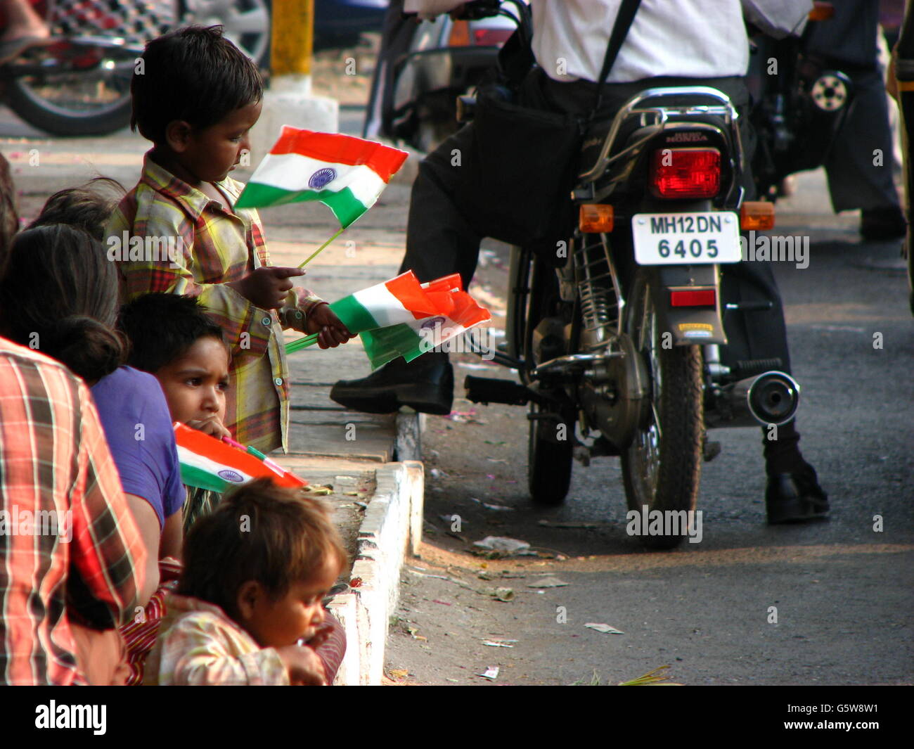 Poor children selling flags on the eve of Independence day in India