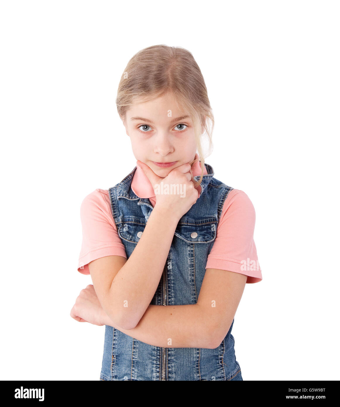 young girl with hand on chin Stock Photo